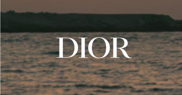 DIOR printed on top a view of seaside