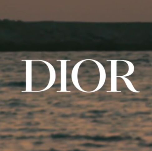 DIOR printed on top a view of seaside